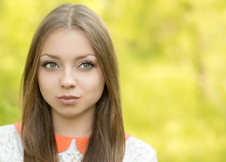Portrait of a young girl on the natureの写真素材