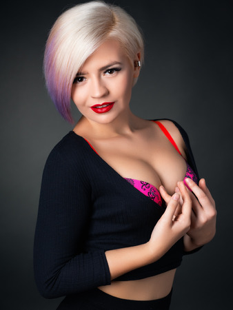 Portrait of a blonde who is posing in a braの写真素材