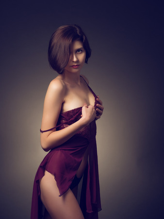 Nude girl in red lingerieの写真素材