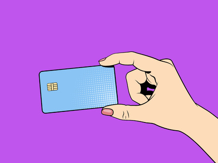 Credit card in hand. Pop art illustrationのイラスト素材