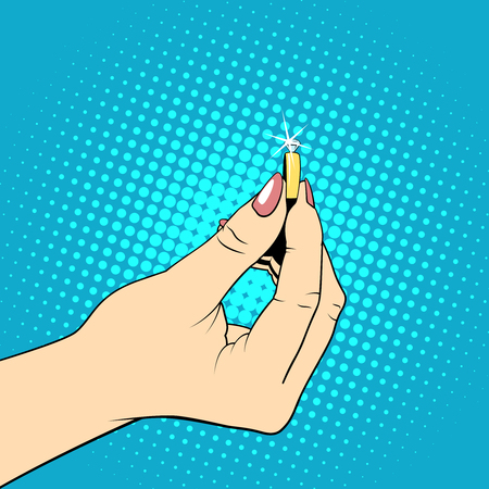 Female hand holding wedding ring. Illustration in pop art styleのイラスト素材