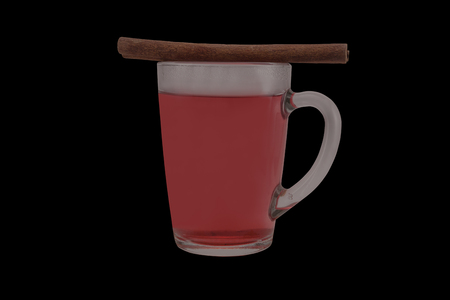 The mug of the hot red fruit tea and the cinnamon stick. The still life is isolated on a black background.の写真素材