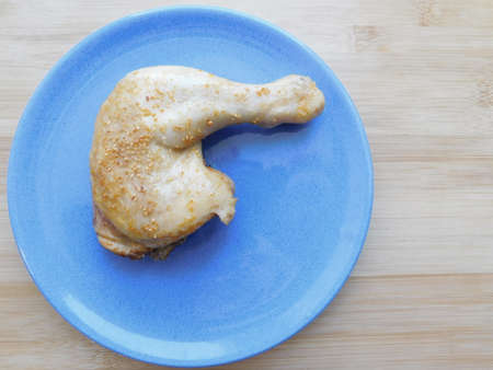 Raw chicken legs. Fresh BIO ingredient for preparation traditional food. Spice, vegetable, herbs, butter. Animal proteins and healthy fats, ceramic plate, wooden background copy spaceの写真素材