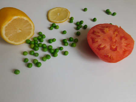 fresh organic tomato, cucumber, lemon and peas on the table. the basis of a healthy diet.の写真素材