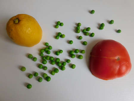 fresh organic tomato, cucumber, lemon and peas on the table. the basis of a healthy diet.の写真素材