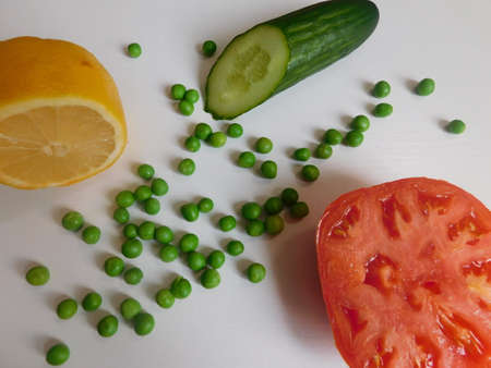 fresh organic tomato, cucumber, lemon and peas on the table. the basis of a healthy diet.の写真素材