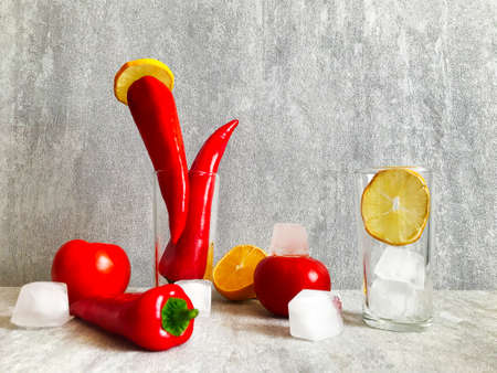 red, fresh peppers on the table. Minimal healthy food concept. Detox menu set, Spicy meal veg fruit cook. Art design card shot above table. Flat lay view close up copy space for text.の写真素材
