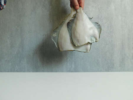 two fresh flounders, large and small, before cooking