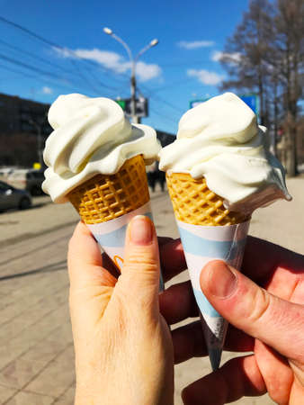 Couple with sweet ice-cream. Two hands with ice cream