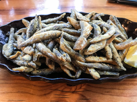 deep-fried anchovies on a plate in a fish restaurant. Bulgaria. Balchikの写真素材