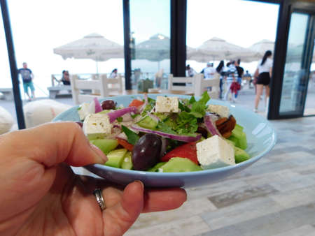 Greek salad bulgarian salad with tomatoes, cucumber, pepper, olives and feta.の写真素材