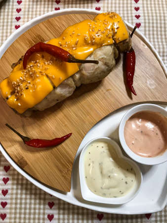 homemade chicken roll with herbs and cheese.