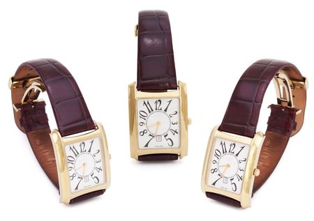 Three Golden Wristwatches isolated on the white backgroundの写真素材