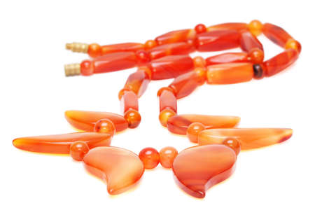 Reddish amber beads isolated on the white backgroundの写真素材