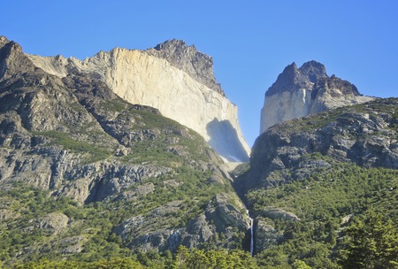 waterfall in torres del paine above rock walls Cuernos in patagoniaの写真素材