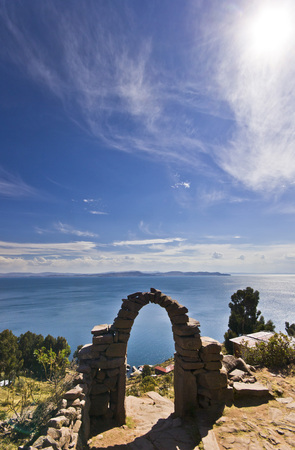 arch above titicaca lake in peru with blue skyの素材 [FY31054662596]