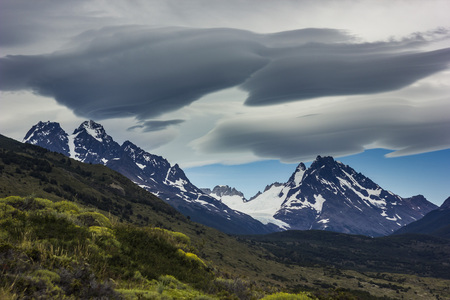 lenticular clouds above snowy mountains in Patagoniaの写真素材