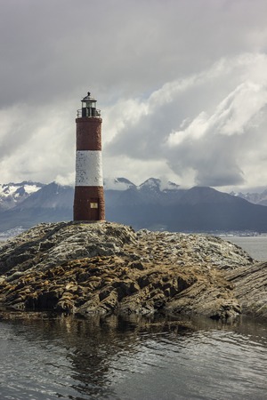 lighthouse on island with fur seals on it near ushuaia , argentinaの写真素材