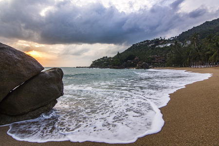 ocean seashore with stone at sunrise in Samui islandの写真素材
