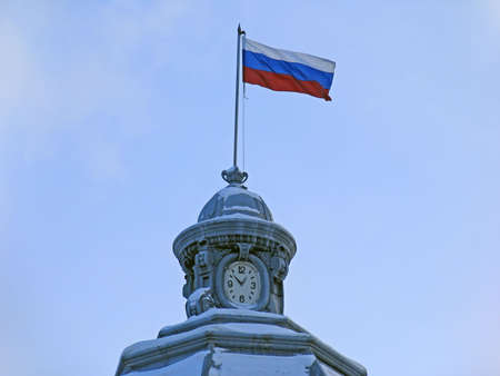 Russian flag and clock. Russia.  Tomsk. の写真素材