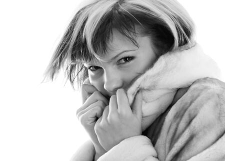 Portrait of frozen girl in fur coatの写真素材
