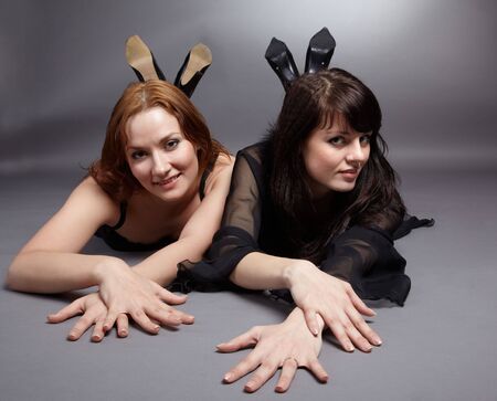 portrait of two beautiful young european models posing in lingerieの写真素材