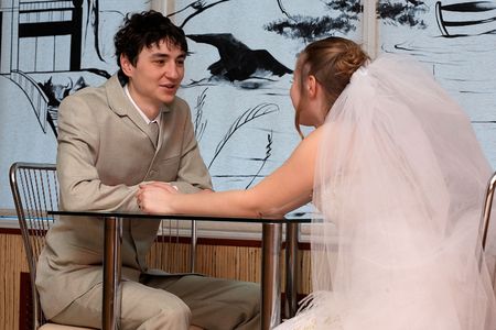 Newly married couple in the restaurantの写真素材