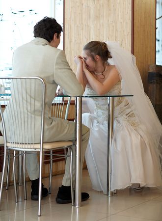 Newly married couple in the restaurantの写真素材