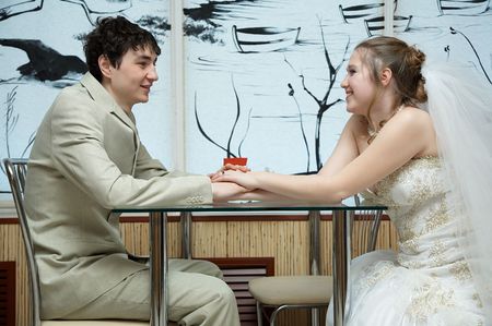 Newly married couple in the restaurantの写真素材