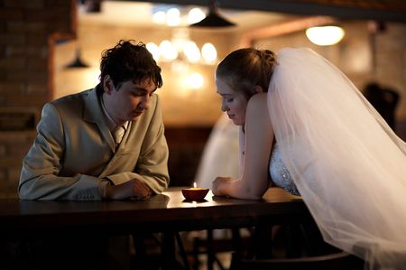 Newly married couple in the restaurantの写真素材