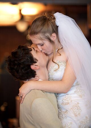 Newly married couple in the restaurantの写真素材