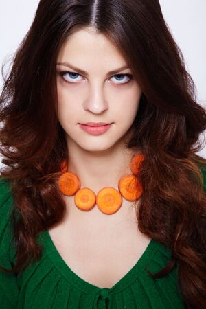 Portrait of Girl with carrot necklaceの写真素材