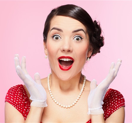 pin-up style portrait of beautiful brunette girl posing in white glovesの写真素材