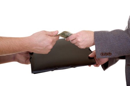 Man's hand with dollars and folder isolated at the white background