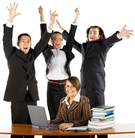 business team with laptop and books near the tableの写真素材