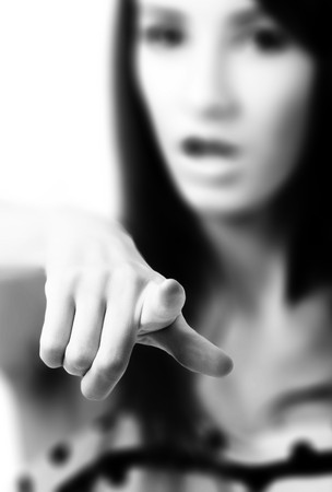 beautiful model in polka-dot dress with black bag looks angryの写真素材