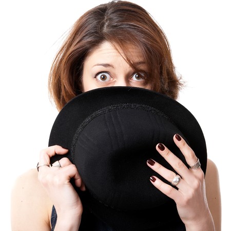 Young woman with hat isolated on the black backgroundの写真素材