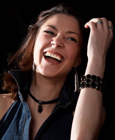 Laughing woman isolated at the black background