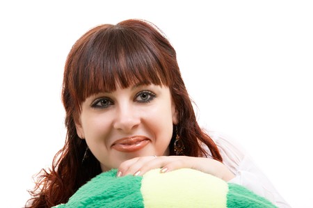 Portrait of brown-haired girl with her lovely toy on white backgroundの写真素材