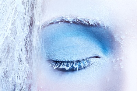 close-up portrait of beautiful girl's eye-zone fantasy snow make-upの写真素材