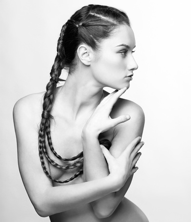 hairstyle portrait of beautiful brunette girl with creative braid hairdoの写真素材