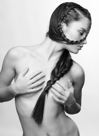 hairstyle portrait of beautiful brunette girl with creative braid hairdoの写真素材