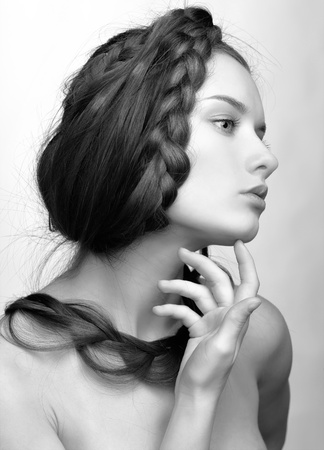 hairstyle portrait of beautiful brunette girl with creative braid hairdoの写真素材