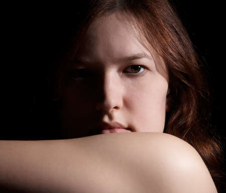 Portrait of woman on black backgroundの写真素材