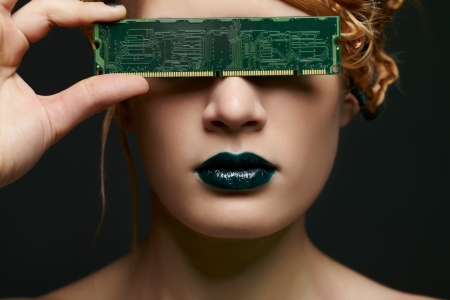 portrait of beautiful young woman closing her eyes with ddr ram memoryの写真素材