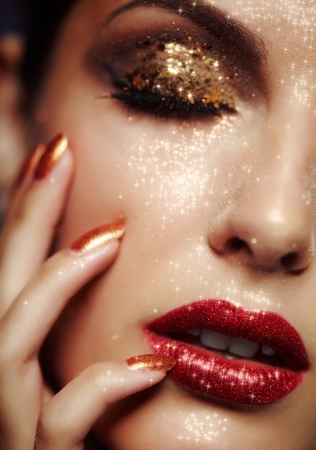 Beautiful young woman with shining face makeup の写真素材