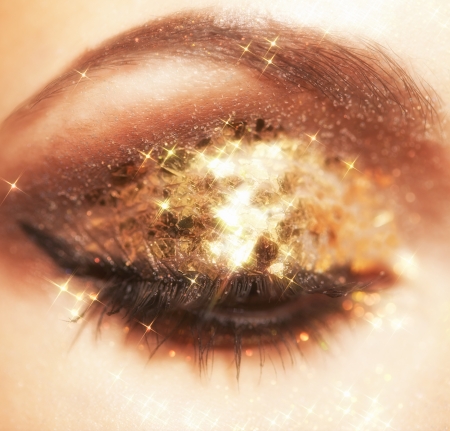 Soft focus portrait of female eye with shining face makeup の写真素材