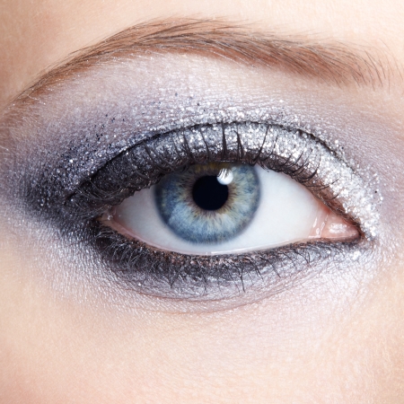 Eye of young woman with vogue shining sparkle makeupの写真素材