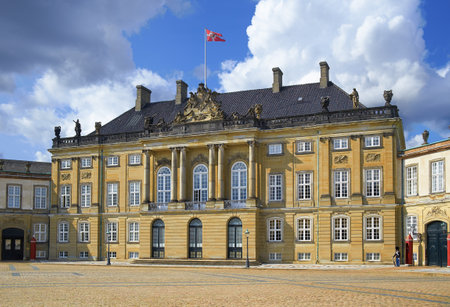 The building of Amalienburg Palace with raised Royal standart over it, Copenhagen, Denmark.のeditorial素材