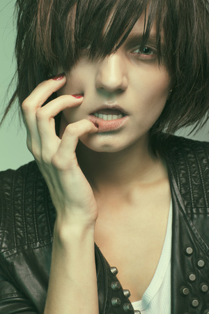 Androgyny female model in Heroin chic style. Old style tinted imageの写真素材